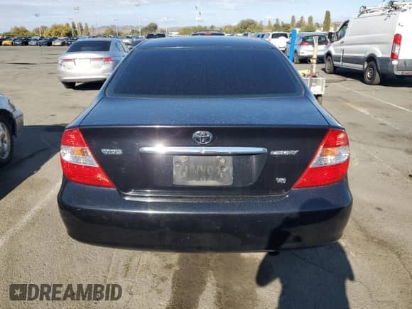 2002 Toyota Camry XLE with VIN 4T1BF30K32U006442, listed as a Copart auction lot 80882015 with 151,964 mi miles and Salvage title. Bid and sale history available at DreamBid. Image 6.