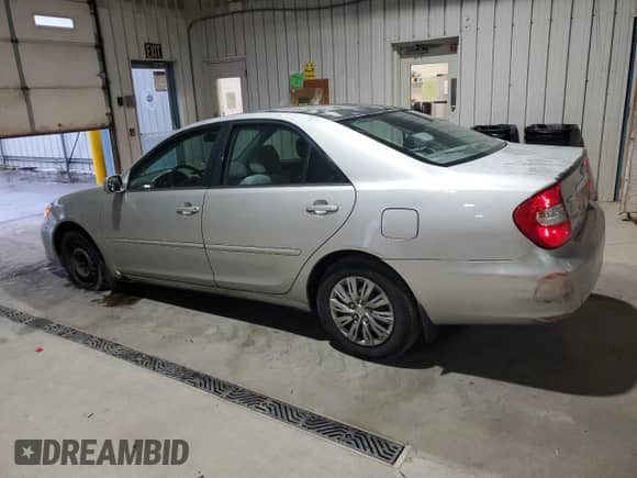 2003 Toyota Camry XLE с VIN 4T1BE32KX3U729691, выставлен на аукционе Copart как лот 84183735 с пробегом 263 739 миль миль и Списание • Salvage title. История ставок и продаж доступна на DreamBid. Изображение 2.