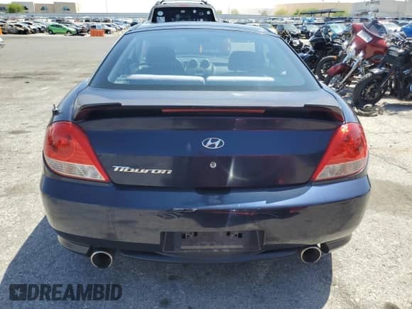 2006 Hyundai Tiburon GS с VIN KMHHM65D06U213565, выставлен на аукционе Copart как лот 58727645 с пробегом 163 844 миль миль и Списание • Salvage title. История ставок и продаж доступна на DreamBid. Изображение 6.