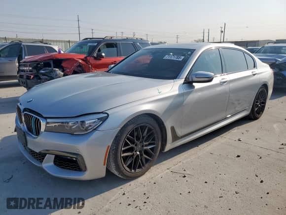 2017 BMW 7 Series 740i xDrive с VIN WBA7E4C58HGU99600, выставлен на аукционе Copart как лот 71171785 с пробегом 91 563 миль миль и Списание • Salvage title. История ставок и продаж доступна на DreamBid. Изображение 1.