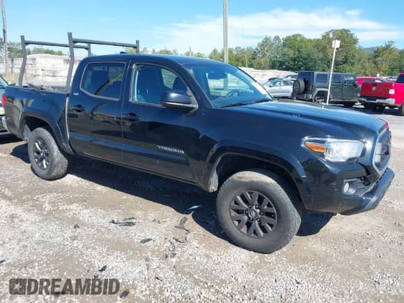 2021 Toyota Tacoma SR with VIN 5TFCZ5AN4MX273658, listed as a IAAI auction lot 43334186 with 70,498 mi miles and . Bid and sale history available at DreamBid. Image 1.