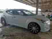 2014 Hyundai Veloster z VIN KMHTC6AD3EU214209, wystawiony jako Copart lot #69948355 z przebiegiem 144 925 mil mil oraz Szkoda całkowita • Salvage title. Historia ofert i sprzedaży dostępna na DreamBid. Obrazek 4.