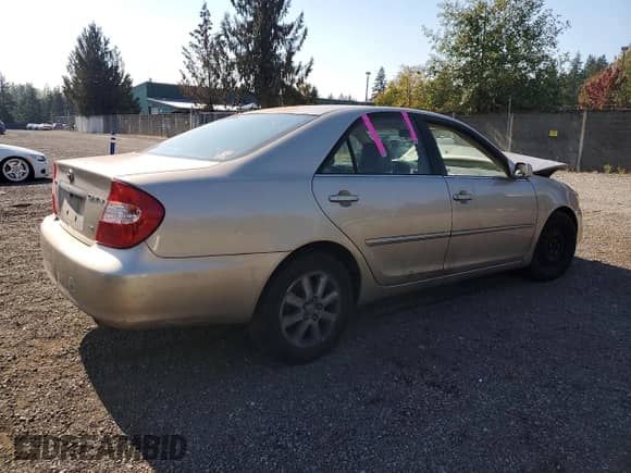 2004 Toyota Camry LE with VIN JTDBF30KX40153887, listed as a Copart auction lot 82175725 with Not provided miles and Salvage title. Bid and sale history available at DreamBid. Image 3.