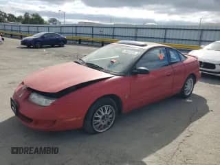 1999 Saturn SC with VIN 1G8ZY127XXZ314531, listed as a Copart auction lot 49653805 with 130,457 mi miles and Salvage title. Bid and sale history available at DreamBid. Image 1.