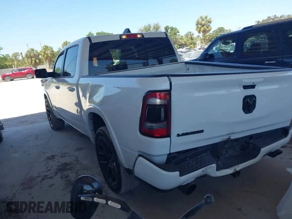 2021 Ram 1500 Laramie with VIN 1C6RREJTXMN794380, listed as a IAAI auction lot 42054107 with 73,370 mi miles and . Bid and sale history available at DreamBid. Image 3.