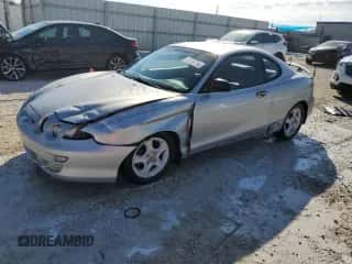 2001 Hyundai Tiburon с VIN KMHJG35F81U246024, выставлен на аукционе Copart как лот 77709294 с пробегом 127 057 миль миль и На запчасти • Non repairable. История ставок и продаж доступна на DreamBid. Изображение 1.