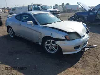 2005 Hyundai Tiburon GT с VIN KMHHN65F05U185005, выставлен на аукционе IAAI как лот 42596711 с пробегом 209 701 миль миль и . История ставок и продаж доступна на DreamBid. Изображение 1.