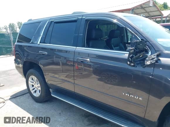 2015 Chevrolet Tahoe LTZ with VIN 1GNSKCKC2FR588524, listed as a IAAI auction lot 42851274 with 101,426 mi miles and . Bid and sale history available at DreamBid. Image 17.