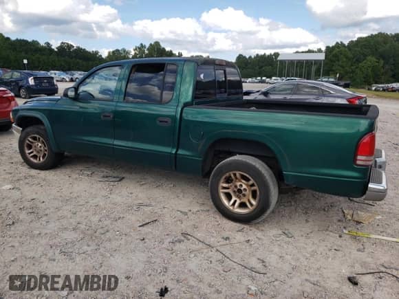 2003 Dodge Dakota SLT с VIN 1D7HL48N73S366294, выставлен на аукционе Copart как лот 71228564 с пробегом 281 401 миль миль и Списание • Salvage title. История ставок и продаж доступна на DreamBid. Изображение 2.