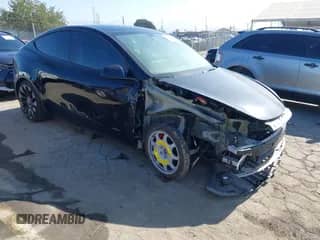 2022 Tesla Model Y Performance with VIN 7SAYGDEF0NF403779, listed as a IAAI auction lot 43010740 with 26,169 mi miles and . Bid and sale history available at DreamBid. Image 1.