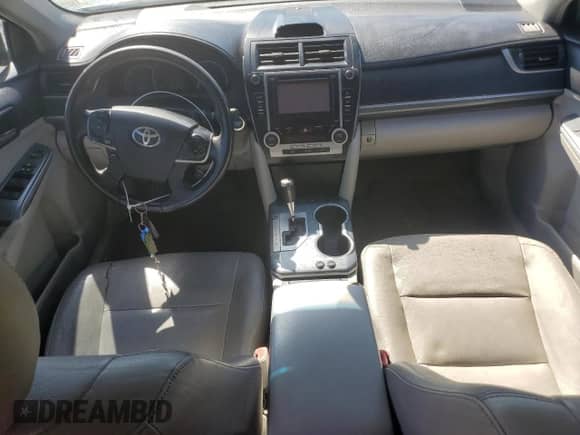 2012 Toyota Camry XLE z VIN 4T1BD1FK8CU022512, wystawiony jako Copart lot #82413865 z przebiegiem Nie podano mil oraz Szkoda całkowita • Salvage title. Historia ofert i sprzedaży dostępna na DreamBid. Obrazek 8.