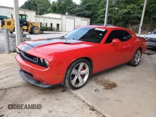 2009 Dodge Challenger SRT-8 с VIN 2B3LJ74W99H502341, выставлен на аукционе Copart как лот 63031805 с пробегом 71 343 миль миль и Списание • Salvage title. История ставок и продаж доступна на DreamBid. Изображение 1.