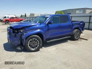2024 Toyota Tacoma SR5 with VIN 3TMKB5FN1RM015474, listed as a Copart auction lot 68934015 with 5,338 mi miles and Salvage title. Bid and sale history available at DreamBid. Image 1.