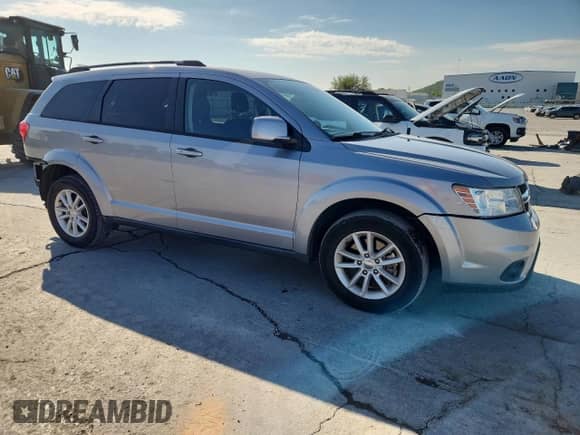2017 Dodge Journey SXT with VIN 3C4PDCBG9HT572469, listed as a Copart auction lot 81464005 with 77,095 mi miles and Salvage title. Bid and sale history available at DreamBid. Image 4.