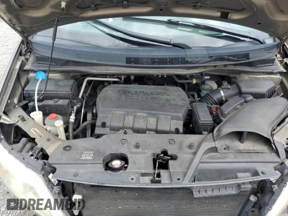 2012 Honda Odyssey EX with VIN 5FNRL5H48CB106771, listed as a Copart auction lot 69810795 with 140,290 mi miles and Salvage title. Bid and sale history available at DreamBid. Image 12.