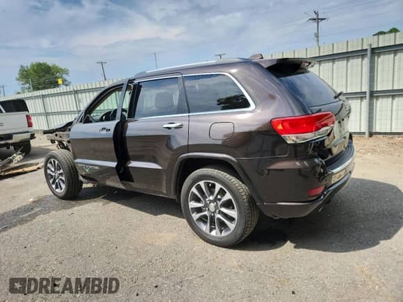 2017 Jeep Grand Cherokee Overland with VIN 1C4RJECG1HC659385, listed as a Copart auction lot 82172205 with 67,873 mi miles and Salvage title. Bid and sale history available at DreamBid. Image 2.