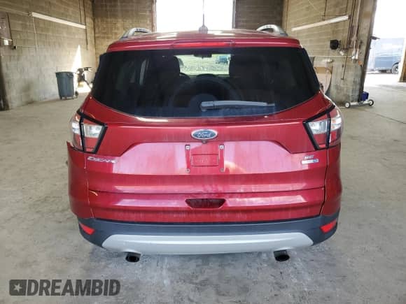 2018 Ford Escape SE с VIN 1FMCU9GDXJUD35058, выставлен на аукционе Copart как лот 82302705 с пробегом 62 136 миль миль и Списание • Salvage title. История ставок и продаж доступна на DreamBid. Изображение 6.