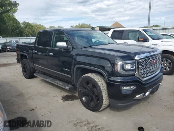 2018 GMC Sierra 1500 Denali with VIN 3GTU2PECXJG521358, listed as a Copart auction lot 70265395 with 99,289 mi miles and Salvage title. Bid and sale history available at DreamBid. Image 4.