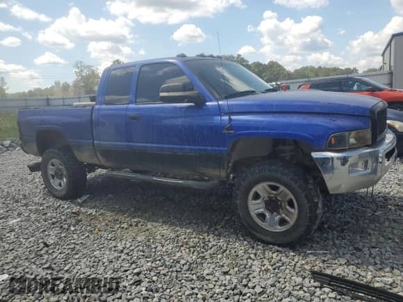 2001 Dodge 2500 with VIN 3B7KF236X1G197808, listed as a Copart auction lot 72450104 with 350,953 mi miles and Salvage title. Bid and sale history available at DreamBid. Image 4.