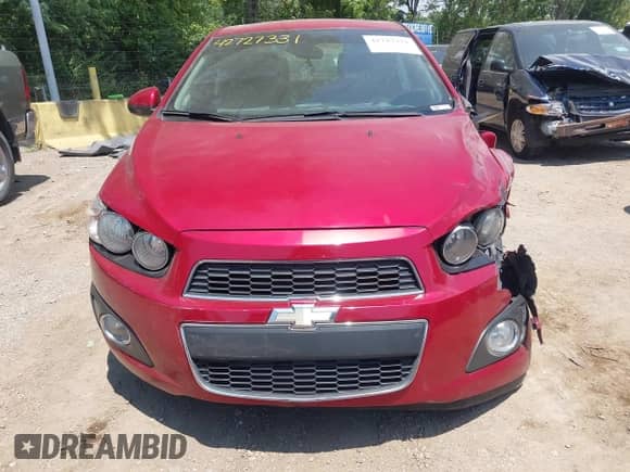 2013 Chevrolet Sonic LTZ z VIN 1G1JE5SBXD4119070, wystawiony jako IAAI lot #42727331 z przebiegiem 152 191 mil mil oraz . Historia ofert i sprzedaży dostępna na DreamBid. Obrazek 12.