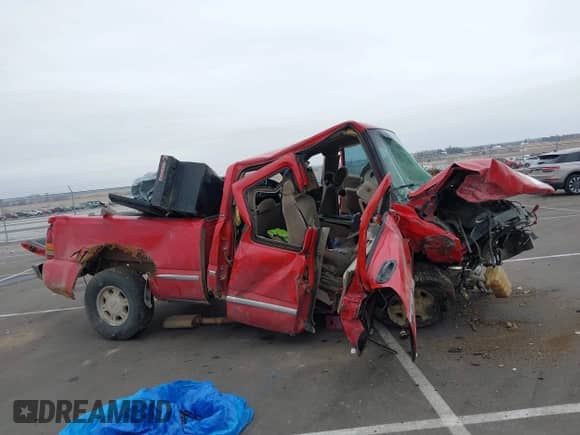 2002 GMC Sierra 1500 SLE z VIN 1GTEK19T72E179324, wystawiony jako IAAI lot #41453383 z przebiegiem Nie podano mil oraz . Historia ofert i sprzedaży dostępna na DreamBid. Obrazek 13.