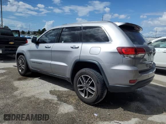2020 Jeep Grand Cherokee Limited with VIN 1C4RJEBG0LC128138, listed as a Copart auction lot 85332895 with 132,587 mi miles and Salvage title. Bid and sale history available at DreamBid. Image 2.