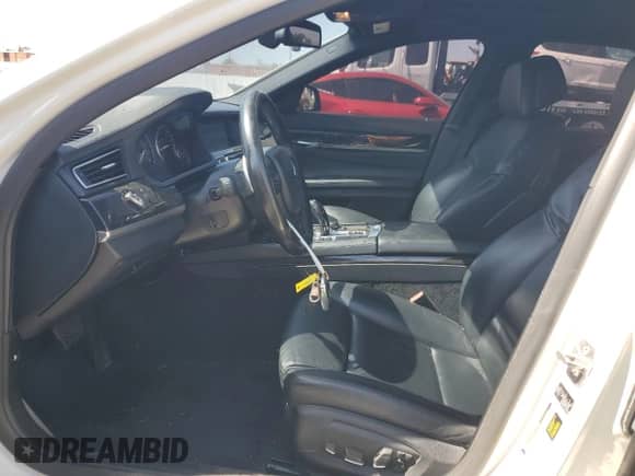 2013 BMW 7 Series 750i with VIN WBAYA8C54DC996412, listed as a Copart auction lot 56982895 with 124,258 mi miles and Salvage title. Bid and sale history available at DreamBid. Image 7.