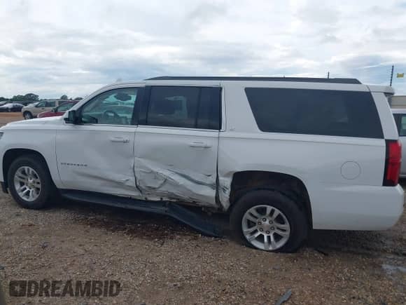 2019 Chevrolet Suburban LT z VIN 1GNSCHKC2KR141759, wystawiony jako IAAI lot #42743049 z przebiegiem 159 914 mil mil oraz . Historia ofert i sprzedaży dostępna na DreamBid. Obrazek 14.