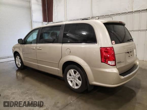 2013 Dodge Grand Caravan Crew with VIN 2C4RDGDG6DR700029, listed as a Copart auction lot 69057705 with 64,797 mi miles and Salvage title. Bid and sale history available at DreamBid. Image 2.