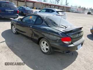 2000 Hyundai Tiburon с VIN KMHJG35F5YU191588, выставлен на аукционе IAAI как лот 41934653 с пробегом 161 590 миль миль и . История ставок и продаж доступна на DreamBid. Изображение 3.