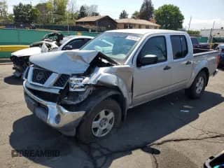 2006 Nissan Frontier SE with VIN 1N6AD07W96C449524, listed as a Copart auction lot 70152475 with 206,553 mi miles and Salvage title. Bid and sale history available at DreamBid. Image 1.