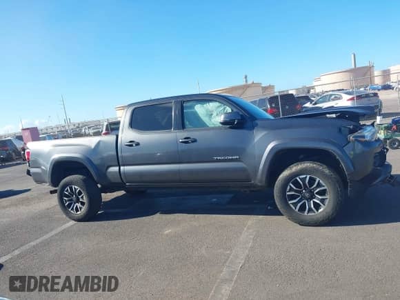 2020 Toyota Tacoma SR5 with VIN 3TMDZ5BNXLM084553, listed as a IAAI auction lot 42556448 with 74,634 mi miles and . Bid and sale history available at DreamBid. Image 14.