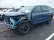 2025 Chevrolet Traverse AWD Z71 z VIN 1GNEVJRS6SJ261722, wystawiony jako IAAI lot #42931447 z przebiegiem 1 457 mil mil oraz . Historia ofert i sprzedaży dostępna na DreamBid. Obrazek 2.