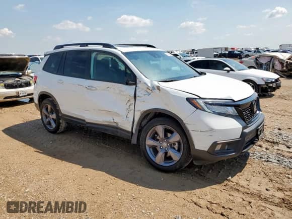 2020 Honda Passport Touring with VIN 5FNYF8H94LB016940, listed as a Copart auction lot 68395245 with 59,282 mi miles and Salvage title. Bid and sale history available at DreamBid. Image 4.