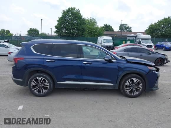 2020 Hyundai Santa Fe SEL with VIN 5NMS3CAA7LH296888, listed as a IAAI auction lot 42442612 with 71,216 mi miles and . Bid and sale history available at DreamBid. Image 13.