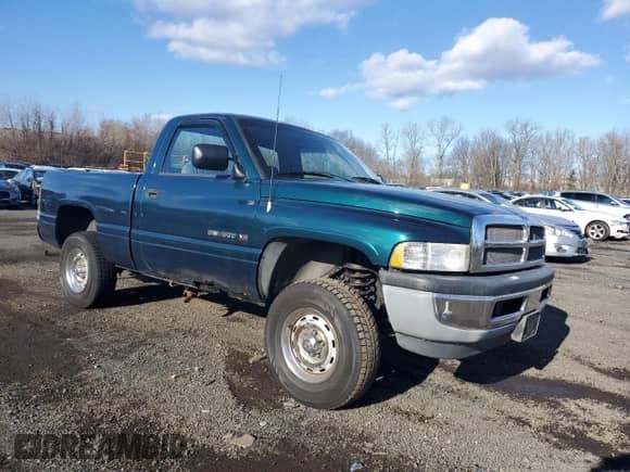 1995 Dodge 1500 with VIN 1B7HF16Y0SS142764, listed as a Copart auction lot 84720074 with 130,034 mi miles and Salvage title. Bid and sale history available at DreamBid. Image 4.
