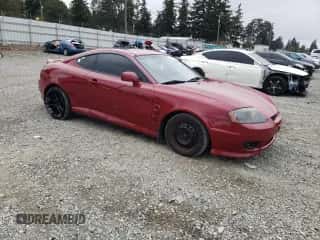 2006 Hyundai Tiburon GT с VIN KMHHN65FX6U228735, выставлен на аукционе Copart как лот 71986204 с пробегом 179 943 миль миль и Списание • Salvage title. История ставок и продаж доступна на DreamBid. Изображение 4.