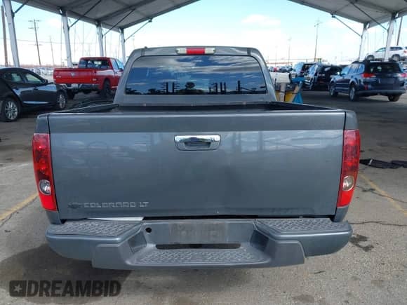 2012 Chevrolet Colorado 1LT z VIN 1GCDSCF90C8157374, wystawiony jako IAAI lot #41701631 z przebiegiem 128 202 mil mil oraz . Historia ofert i sprzedaży dostępna na DreamBid. Obrazek 16.