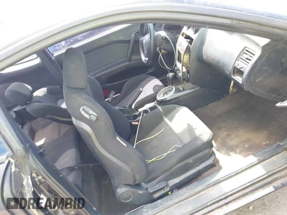 2004 Hyundai Tiburon with VIN KMHHM65D34U125669, listed as a IAAI auction lot 42320274 with 176,358 mi miles and . Bid and sale history available at DreamBid. Image 5.