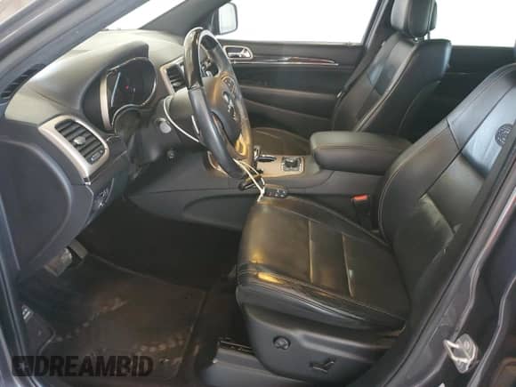 2015 Jeep Grand Cherokee Overland with VIN 1C4RJFCG8FC158061, listed as a Copart auction lot 80517975 with 115,889 mi miles and Salvage title. Bid and sale history available at DreamBid. Image 7.