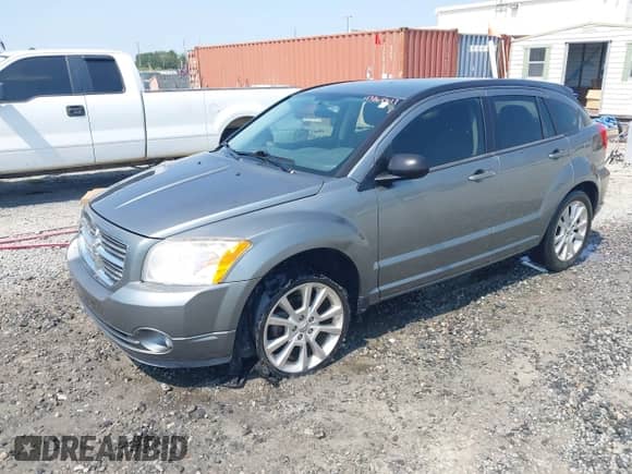 2011 Dodge Caliber Heat with VIN 1B3CB5HA4BD256852, listed as a IAAI auction lot 43264617 with 201,409 mi miles and . Bid and sale history available at DreamBid. Image 2.