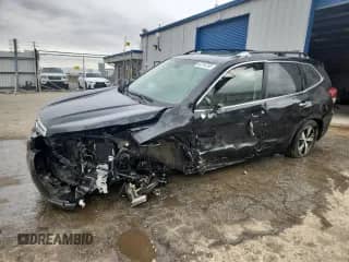2019 Subaru Forester Touring with VIN JF2SKAWC1KH489668, listed as a Copart auction lot 82194765 with 95,767 mi miles and Salvage title. Bid and sale history available at DreamBid. Image 1.