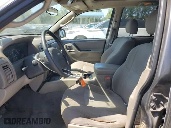 2004 Jeep Grand Cherokee Laredo with VIN 1J4GX48S94C381627, listed as a Copart auction lot 70754855 with 318,672 mi miles and Salvage title. Bid and sale history available at DreamBid. Image 7.