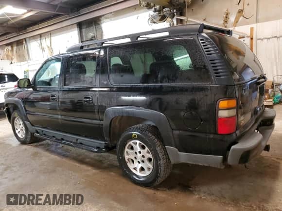 2004 Chevrolet Suburban Z71 z VIN 3GNFK16Z94G101398, wystawiony jako Copart lot #70914914 z przebiegiem 223 578 mil mil oraz Szkoda całkowita • Salvage title. Historia ofert i sprzedaży dostępna na DreamBid. Obrazek 2.