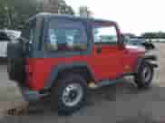 2000 Jeep Wrangler SE with VIN 1J4FA29P8YP711686, listed as a Copart auction lot 68999455 with 100,108 mi miles and Salvage title. Bid and sale history available at DreamBid. Image 3.