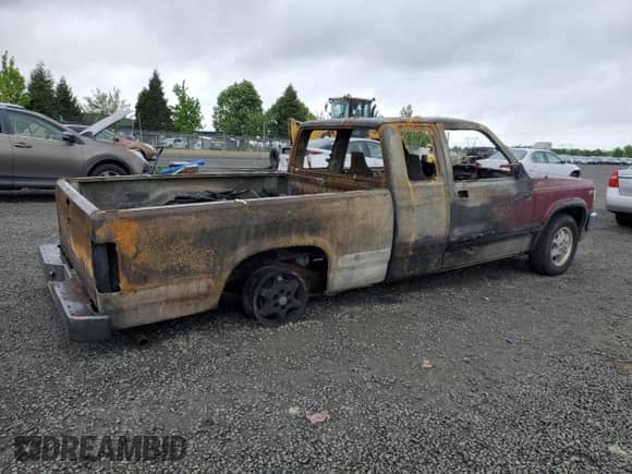1995 Dodge Dakota с VIN 1B7GL23X6SS144198, выставлен на аукционе Copart как лот 57501855 с пробегом Не указан миль и Списание • Salvage title. История ставок и продаж доступна на DreamBid. Изображение 3.