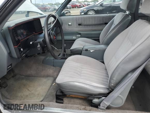 1987 Chevrolet Monte Carlo with VIN 1G1GZ11G8HR122000, listed as a Copart auction lot 65437615 with 59,731 mi miles and Salvage title. Bid and sale history available at DreamBid. Image 7.