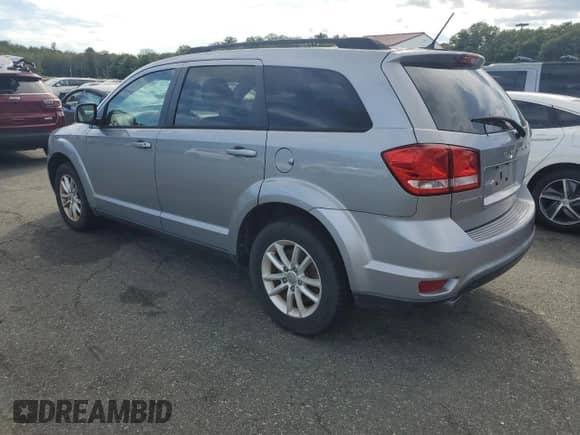 2017 Dodge Journey SXT with VIN 3C4PDCBG3HT536597, listed as a Copart auction lot 69964525 with 128,638 mi miles and Salvage title. Bid and sale history available at DreamBid. Image 2.