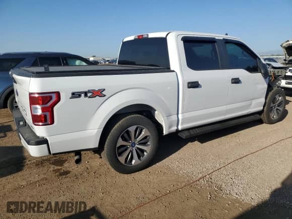 2020 Ford F-150 XL with VIN 1FTEW1CPXLFA15710, listed as a Copart auction lot 61944055 with 98,561 mi miles and Salvage title. Bid and sale history available at DreamBid. Image 3.