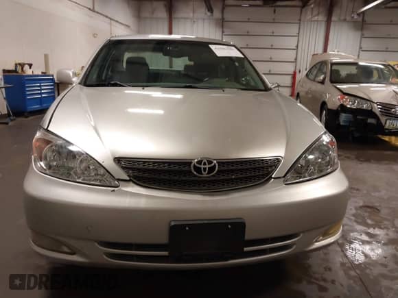 2002 Toyota Camry LE z VIN 4T1BE32K02U033310, wystawiony jako IAAI lot #42586585 z przebiegiem 154 658 mil mil oraz . Historia ofert i sprzedaży dostępna na DreamBid. Obrazek 13.